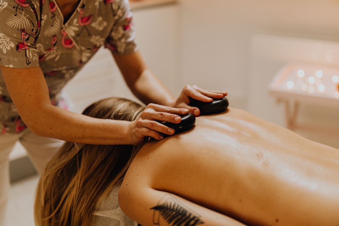 Therapist performing a back and shoulder massage at Umdlalo Wellness Spa, KZN South Coast