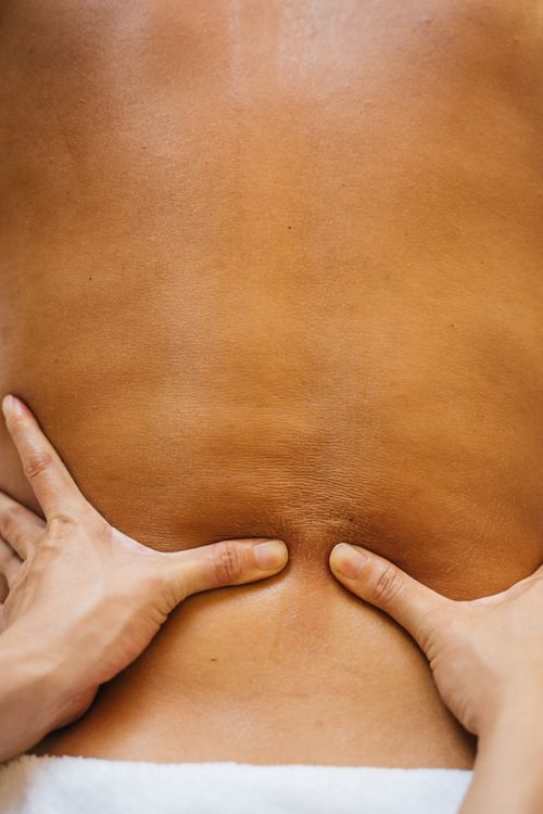 Therapist Zingisa performing a back massage at Umdlalo Wellness Spa, KZN South Coast